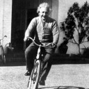 Albert Einstein on a bike.