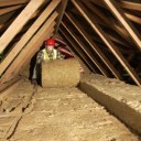 man-installing-insulation